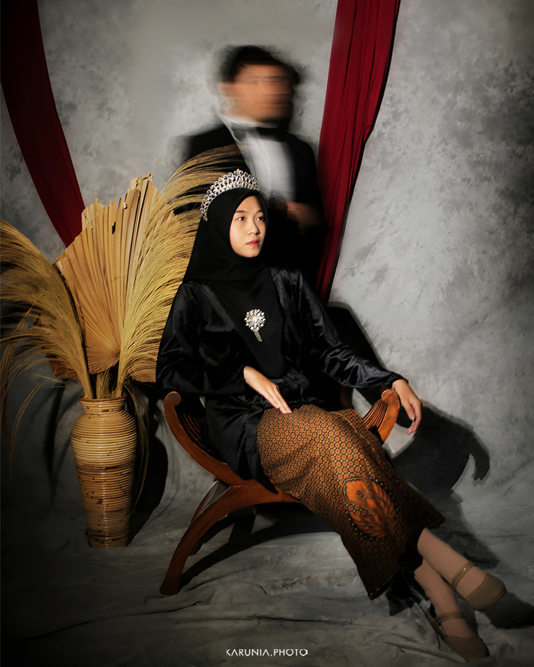 Bride and groom-to-be holding hands and walking along city streets with romantic bokeh lights